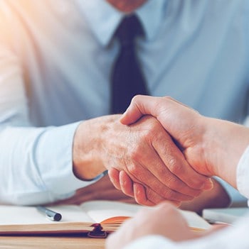 A handshake — 100% of our growth is referral-driven