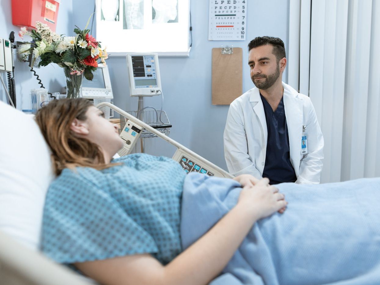 Physician with a patient at the bedside