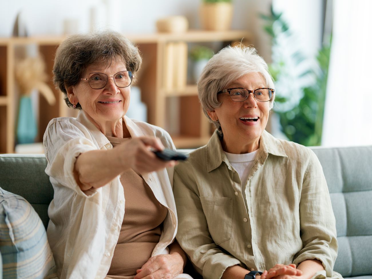 Assisted living residents enjoying TV together