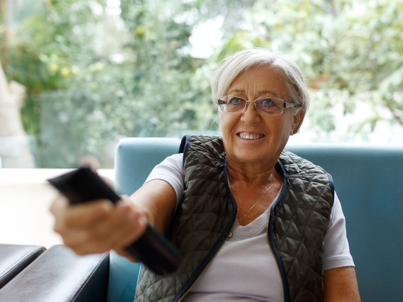 A calm, familiar routine — resident with her remote