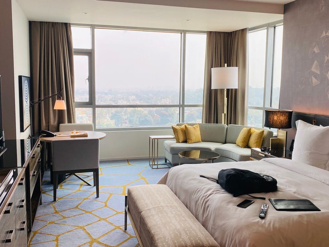 A hotel suite with a wall-mounted DIRECTV television