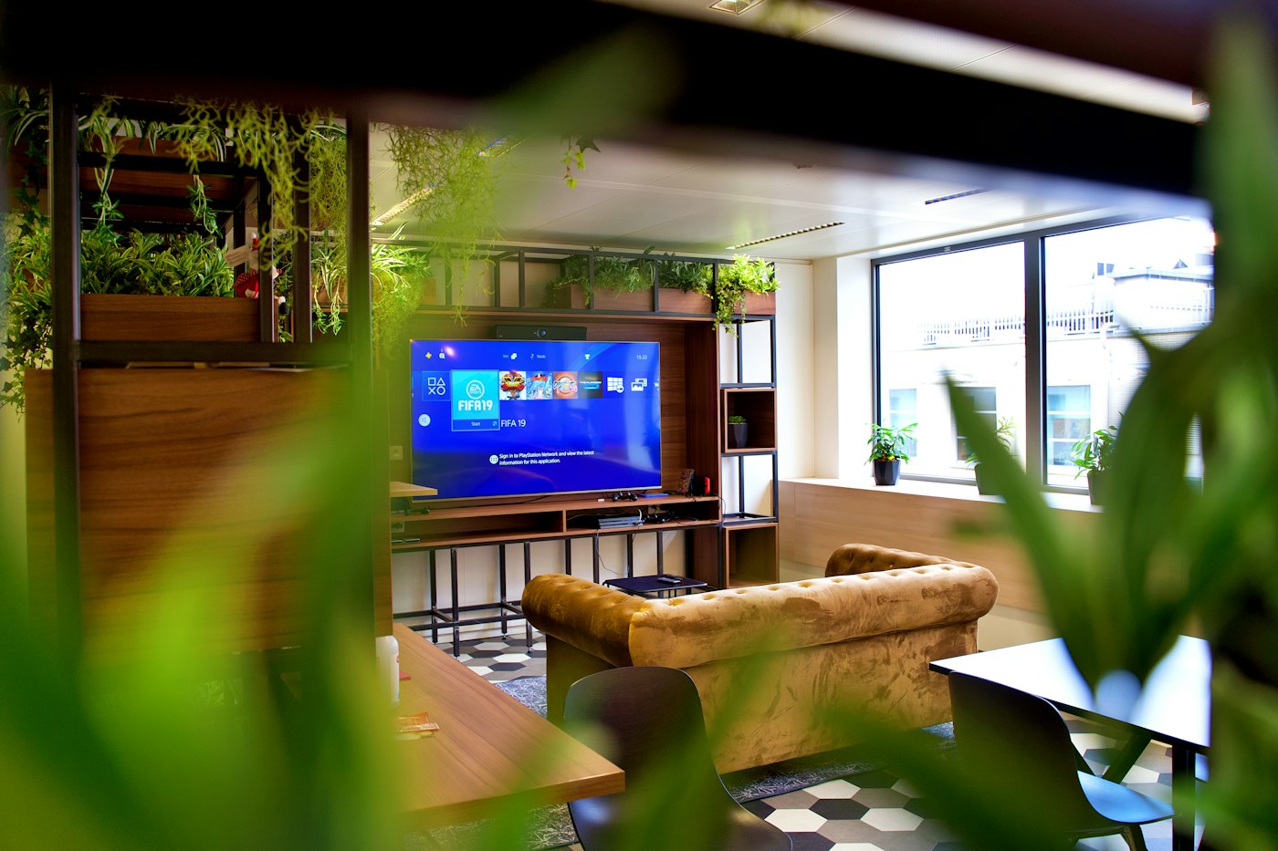 A campus lounge with a large television