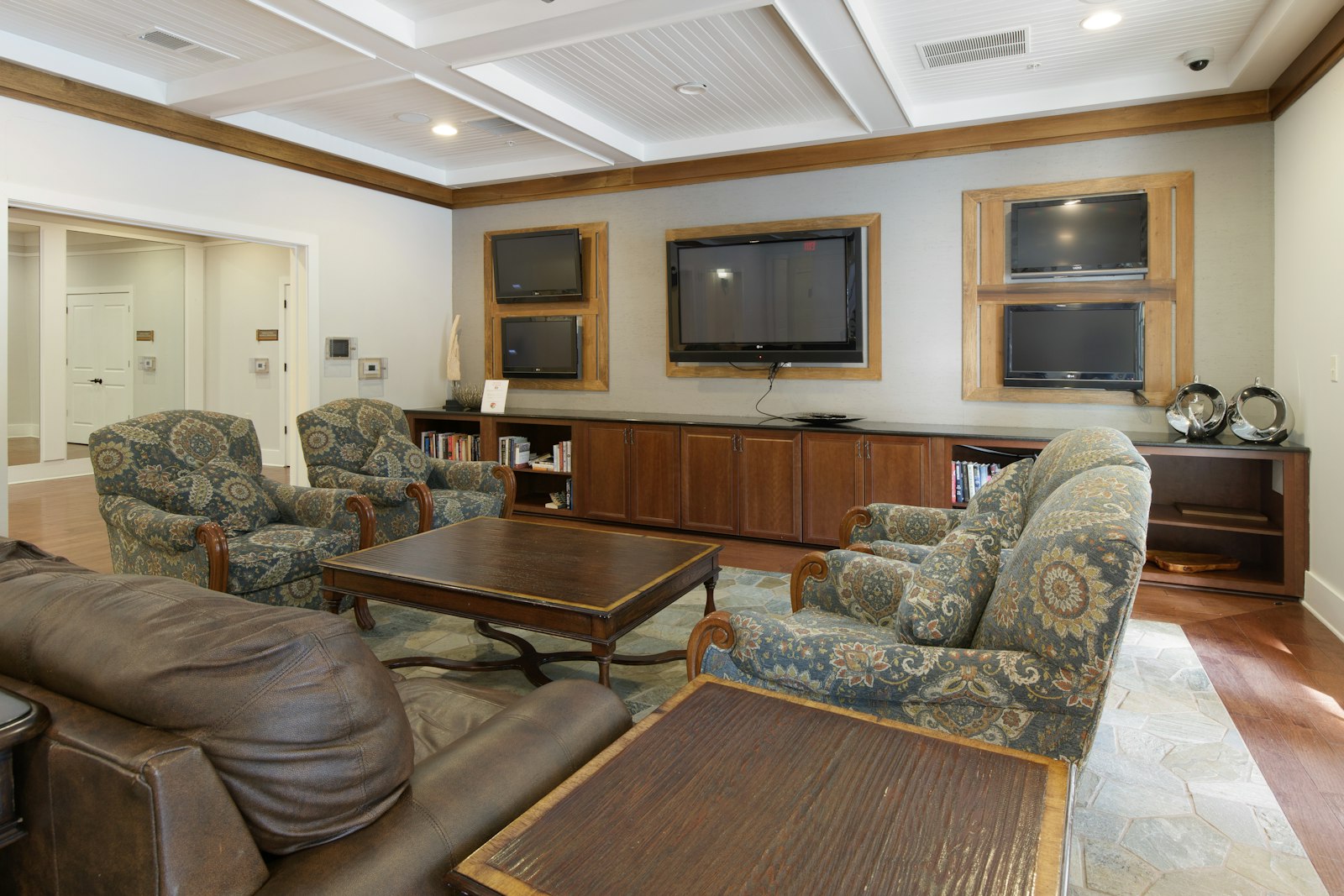 A senior living community room with televisions