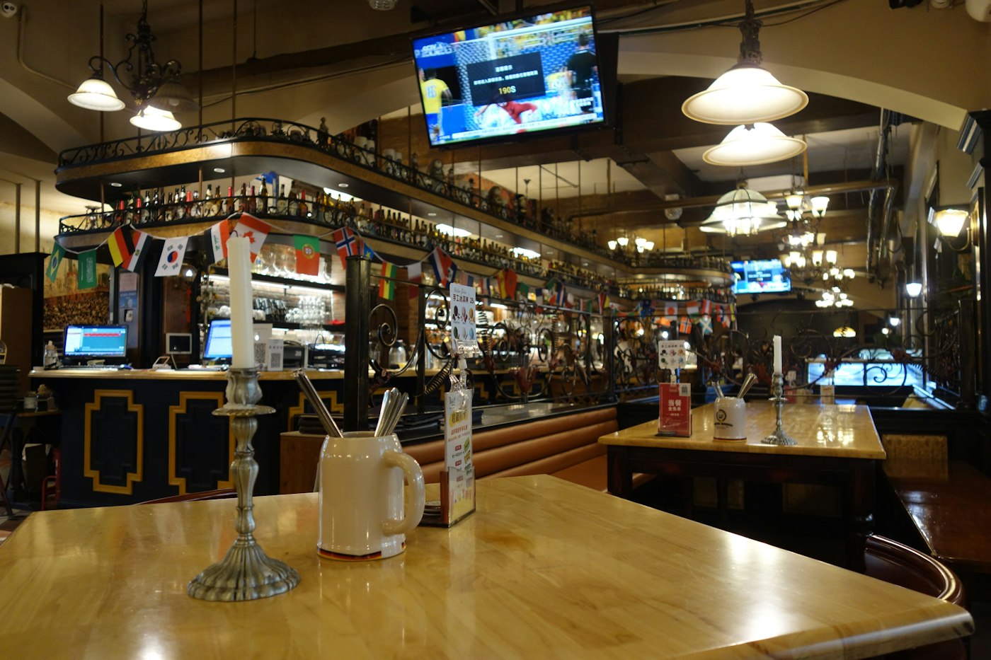 A pub dining room with TVs on the walls